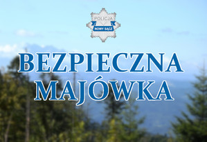 napis Bezpieczna majówka, logo sądeckiej policji, w tle góry