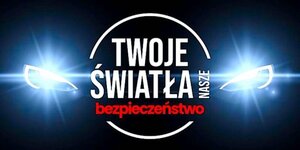 święcące reflektory samochodu, między nimi napis Twoje światła - Nasze bezpieczeństwo
