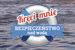 koło ratunkowe, napis Kręci mnie bezpieczeństwo nad wodą, w tle tafla jeziora